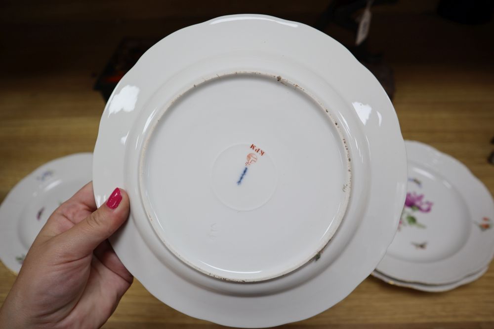 A set of eight Berlin plates, decorated with butterflies and flowers, diameter 21cm (5) and 24cm (3)